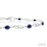 4X3 MM Oval Cut Sapphire and 1/5 Ctw Round Cut Diamond Precious Eternity Link Tennis Bracelet in 10K White Gold